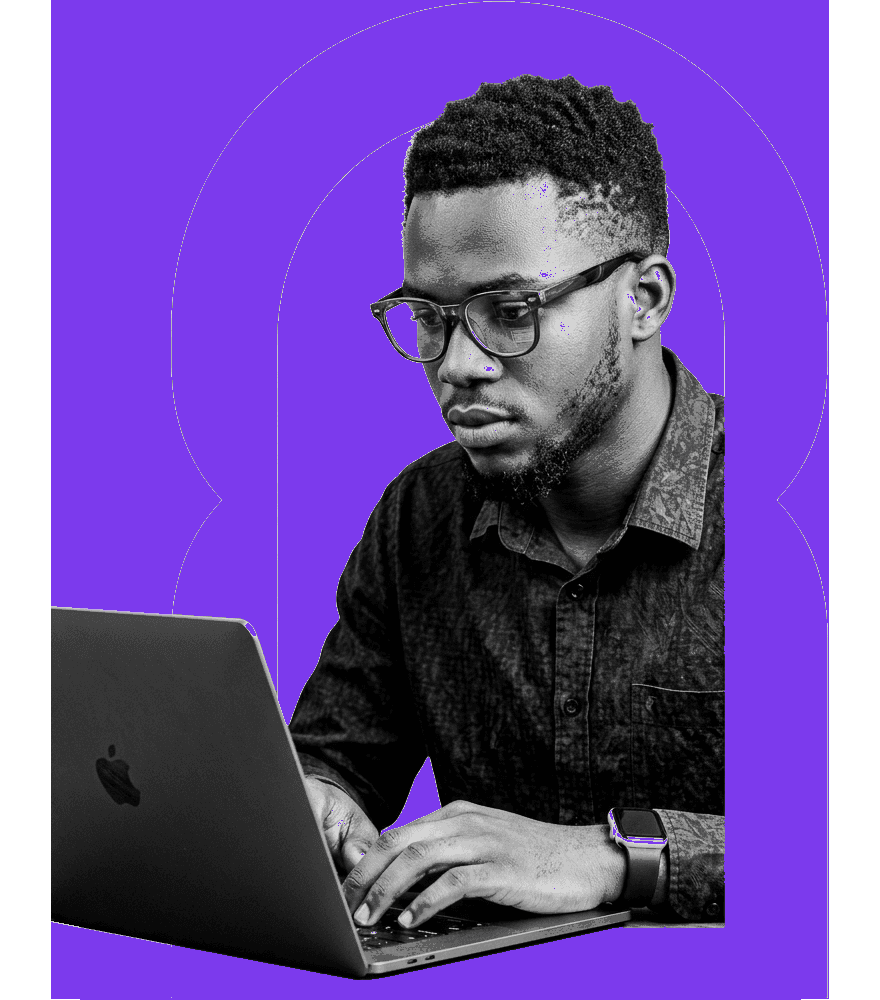 Nigerian male tech student with glasses and Apple Watch intently programming on MacBook popping out of wide Passizy electric purple arch